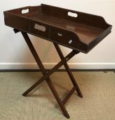 A mahogany and brass bound butlers tray of typical form on folding stand 76 cm x 51 cm