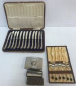 A cased set of twelve silver pistol grip butter knives (Sheffield, 1911 by John Sanderson),