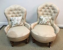 A pair of late Victorian ladies and gents buttoned upholstered low salon elbow chairs,