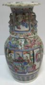 A 19th Century Chinese famille rose vase with figural panel decoration and gilt lined flared rim,
