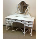 A circa 1900 painted pine dressing chest in the Adam style with shaped mirror on scrollwork