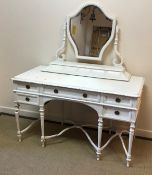 A circa 1900 painted pine dressing chest in the Adam style with shaped mirror on scrollwork