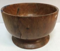 A large turned yew wood pedestal fruit bowl turned of a single piece 38.5 cm diameter x 24.