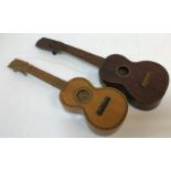 An unnamed ukulele banjo with case and two unnamed guitar ukuleles