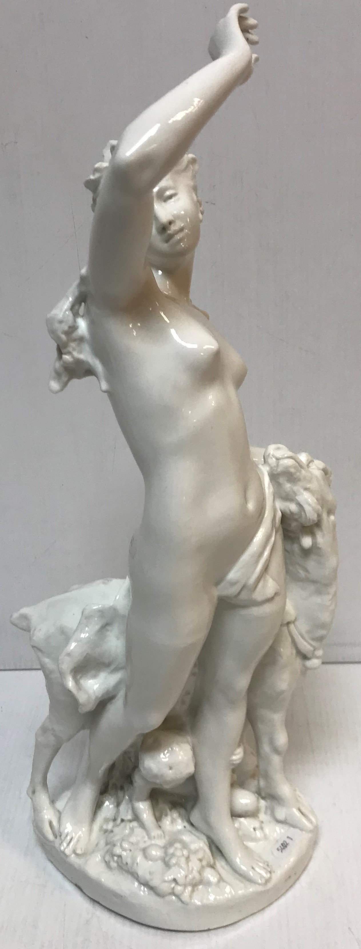 A late 19th Century blanc de chine figure of "Nude with a goat", 53.