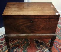 An early 19th Century mahogany teapoy or tea chest in the style of Gillows,
