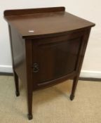 An early to mid 20th Century walnut bow fronted bedroom chest in the Georgian style,