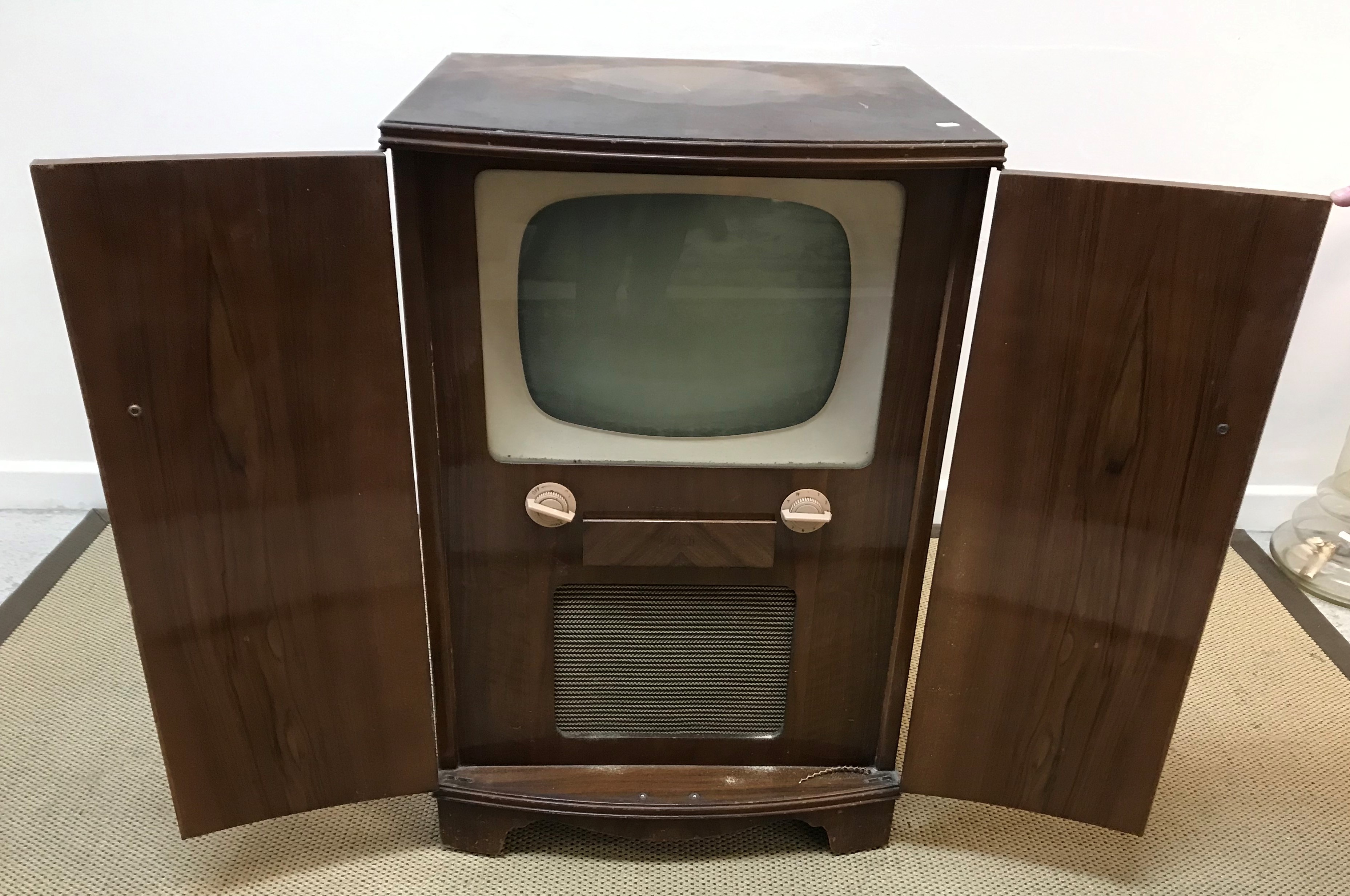 A walnut cased Decca model DMC/17D television in bow fronted cabinet 60 cm wide x 52 cm deep x 92