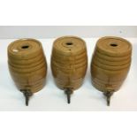 A collection of three salt glazed spirit barrels each impressed "One" and "Powell Bristol" 24 cm