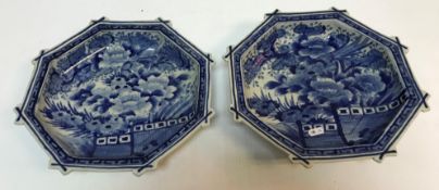 A pair of Japanese blue and white octagonal shallow dishes set with foliate and bird decoration