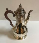 A modern silver coffee pot in the Georgian taste with wooden handle (by J.B.