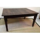 A mahogany rectangular extending dining table with reeded edge on square fluted and tapered legs to