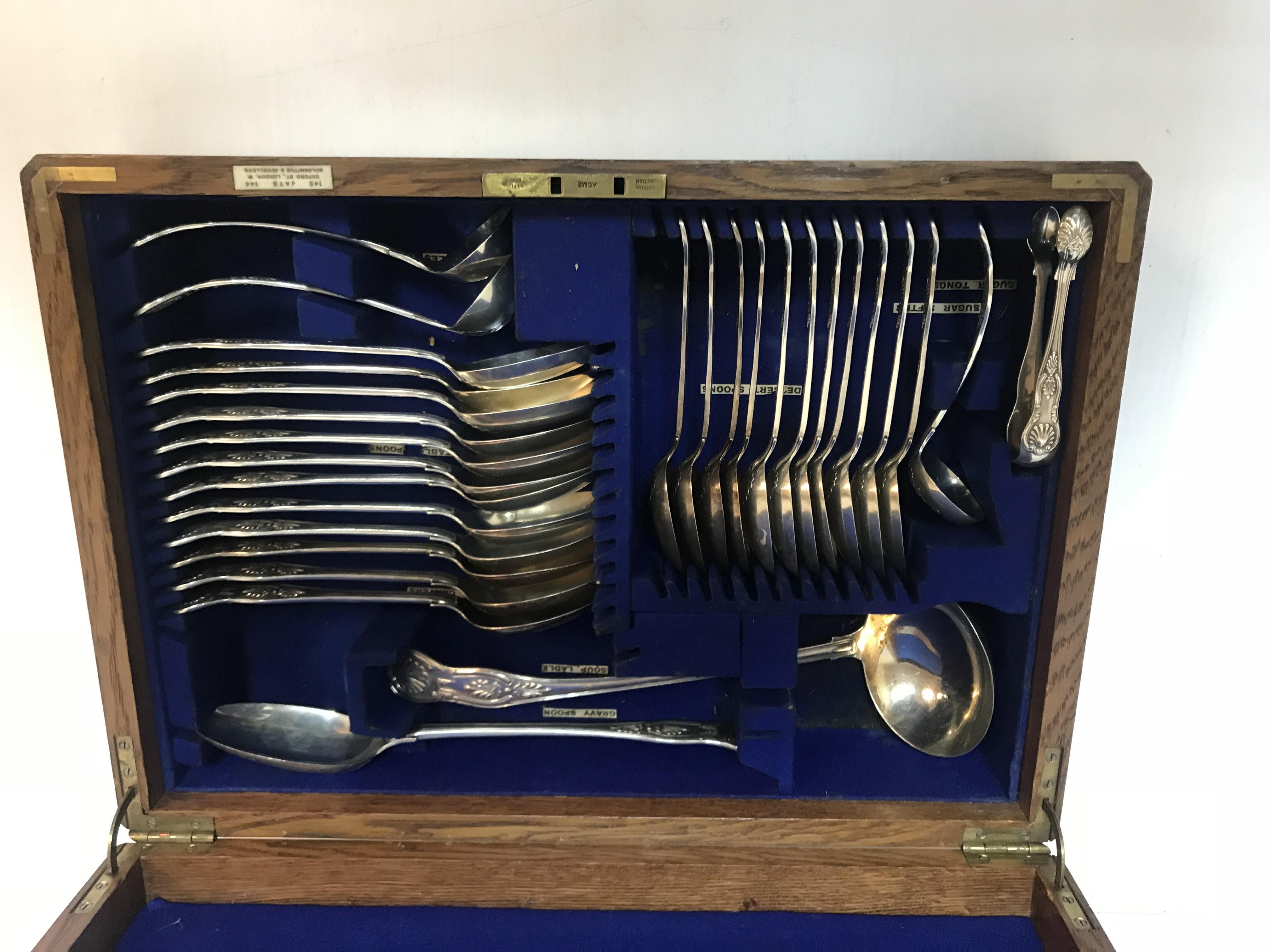 An Edwardian oak canteen of silver kings pattern cutlery comprising eight table forks, - Image 2 of 3