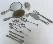 An Onslow pattern tablespoon, a silver backed hand mirror, silver backed hairbrush,
