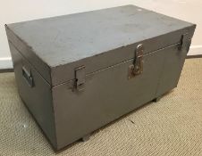 A silver painted tin trunk with central lock and double hasp and staple flanked by carrying handles,