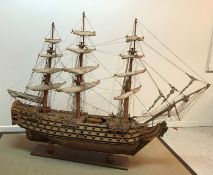 A mid 20th Century craftsman built wooden model of HMS Victory together with copy of Harrods