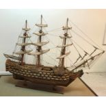 A mid 20th Century craftsman built wooden model of HMS Victory together with copy of Harrods