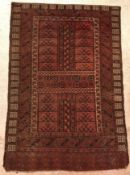 A Hatchli Bokhara rug, the central panel set with two panels,