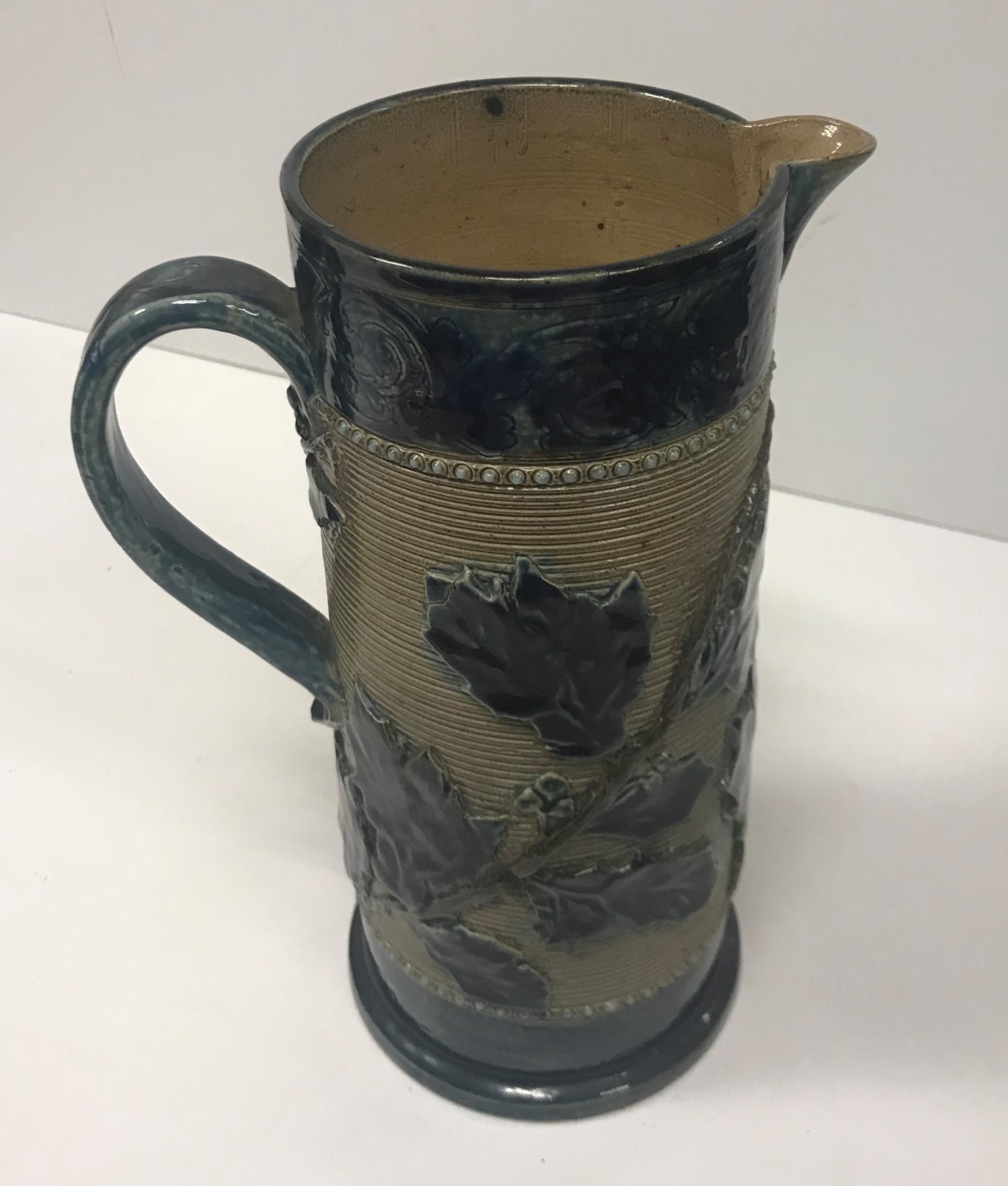 A Victorian glazed stoneware jug with holly decoration, - Image 2 of 27