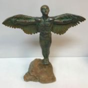 A Louise Vergette bronzed and verdigris statue of Icarus on a rock 56 cm high x 44.
