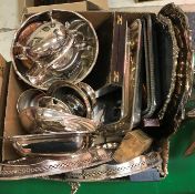 A box of assorted plated wares to include two pierced rim trays, two salvers,