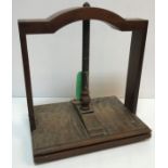 A 19th Century walnut and oak table top book press of typical form 43 cm x 31 cm x 48 cm high