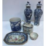 A similar pair of 19th Century Chinese blue and white hexagonal baluster vases and covers decorated