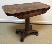 An early Victorian rosewood fold-over card table on tapering turned pedestal to platform quadruped