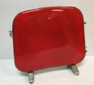A mid 20th Century Falks Caprice heater in red bearing label together with a matching cream version