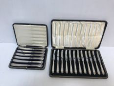 A cased set of twelve silver handled butter knives (Sheffield,