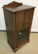 An Edwardian mahogany music cabinet,