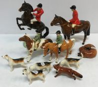 A collection of Beswick hunting figures to include "Huntsman on rearing horse",