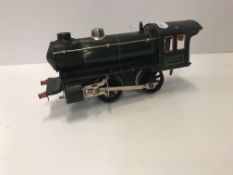 A Marklin 0-40- tank loco, wagon, grinder and fly wheel,