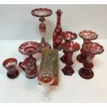 A collection of ruby glass overlaid vases, table lustre, bottle, mug, squat vase and tazza (10),