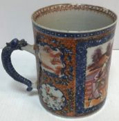 A Chinese Kang Xi blue and white and polychrome decorated mug,