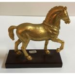 A 19th Century ormolu figure of a Spanish horse on a mahogany base unnamed,