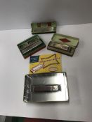 A box containing four various harmonicas to include a Reinhold Fridel World Star,