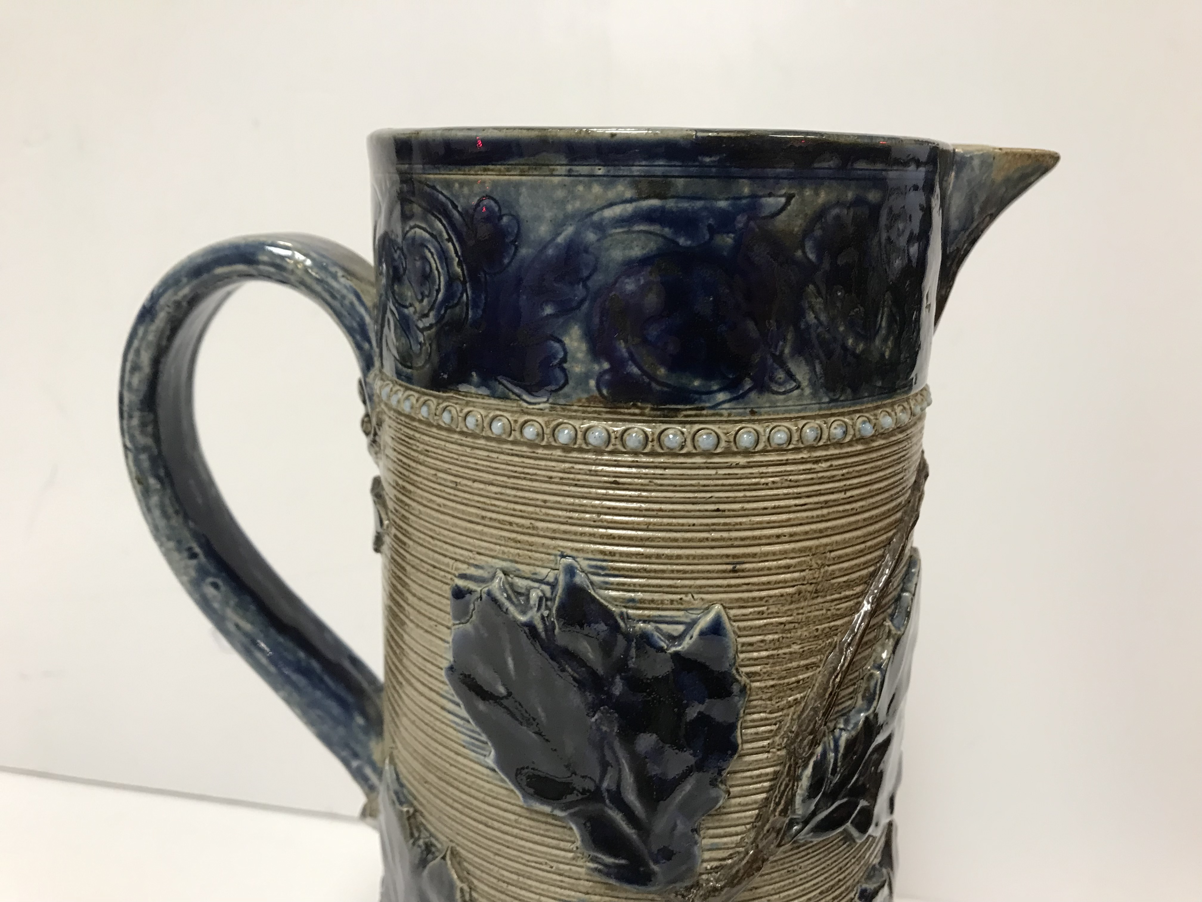 A Victorian glazed stoneware jug with holly decoration, - Image 5 of 27