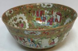 A 19th Century Chinese famille rose fruit bowl decorated with panels of figures in interiors and