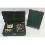 A green leather jewellery box containing various costume jewellery to include a jade beaded