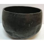 A 19th Century Japanese beaten copper gong or singing bowl with nine character marks around rim