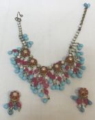 A circa 1950 Christian Dior necklace by Mitchel Maer and a pair of earrings set with simulated