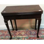 A George III style mahogany triple fold-over card / tea table with plain and baize-lined surfaces