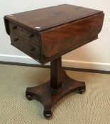 A Victorian mahogany drop leaf work table with two drawers on faceted pedestal to quadruped