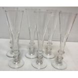 A set of six 20th Century champagne or ale flutes in the Georgian style with facet cut bowls on a