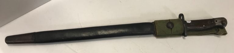 A Wilkinsons 1907 bayonet with leather scabbard,