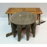 An African (Nupe) tribal ten legged stool with carved decoration to top 28.