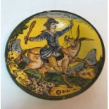 A 19th Century Italian majolica dish, the centre decorated with gentleman with club on mule,