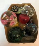 A collection of various paperweights etc to include Victorian green glass dump style weight with