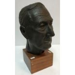 A mid 20th Century bust of a gentleman set on a square mahogany base bearing label inscribed "...
